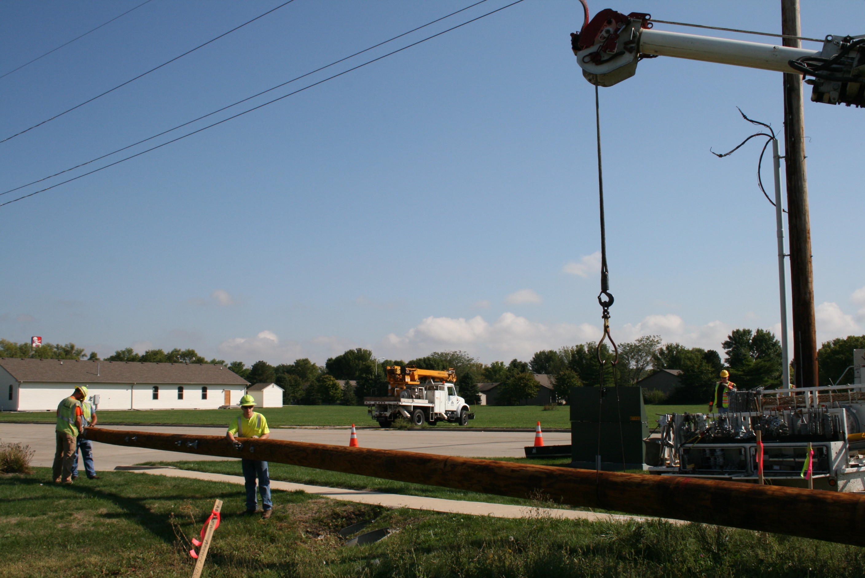 Crews Working to Install New Power Pole